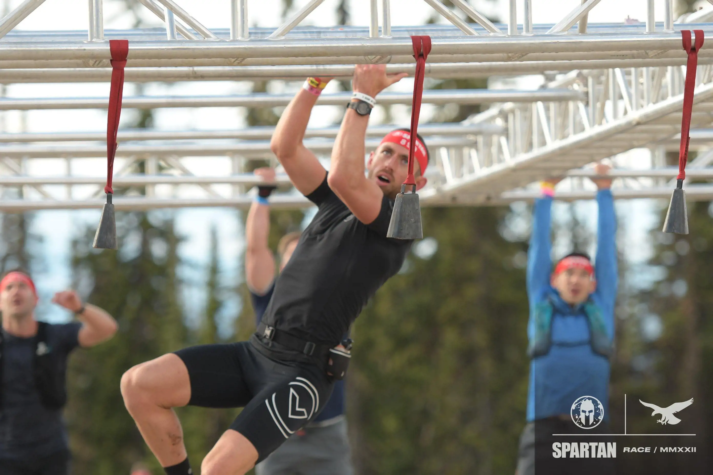Image of Noah Grime navigating an obstacle in a Spartan event