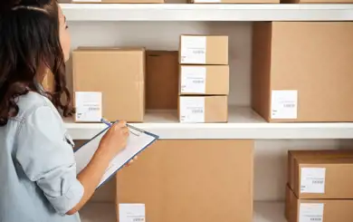 Image of business person evaluating their inventory in a storage unit | SmartStop