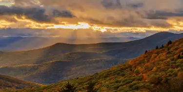Image of mountain chain with clouds at sunset