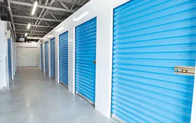 Image of sealed storage units lining an interior hallway