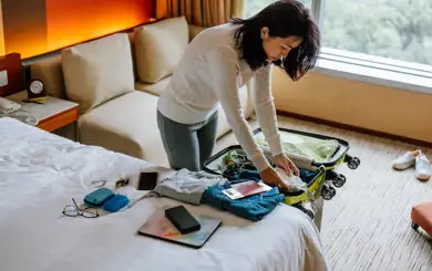 Person packing for an extended travel trip | SmartStop