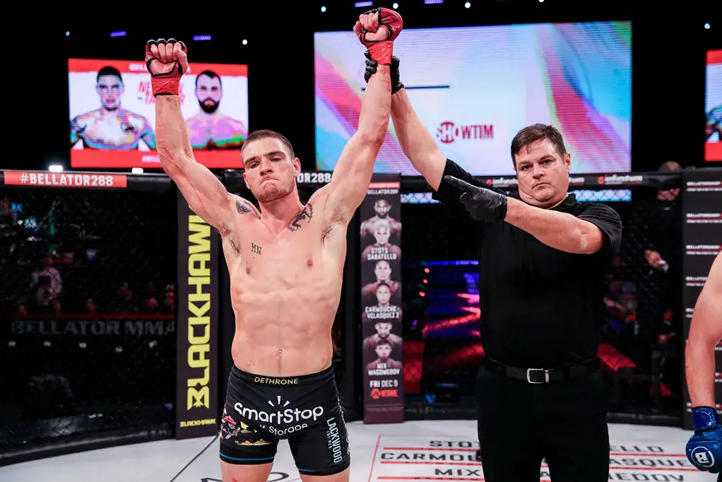 MMA fighter, Jordan Newman having his hand raised in victory