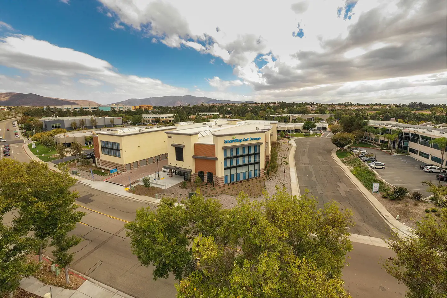 Image of a SmartStop building exterior with trees and blue sky