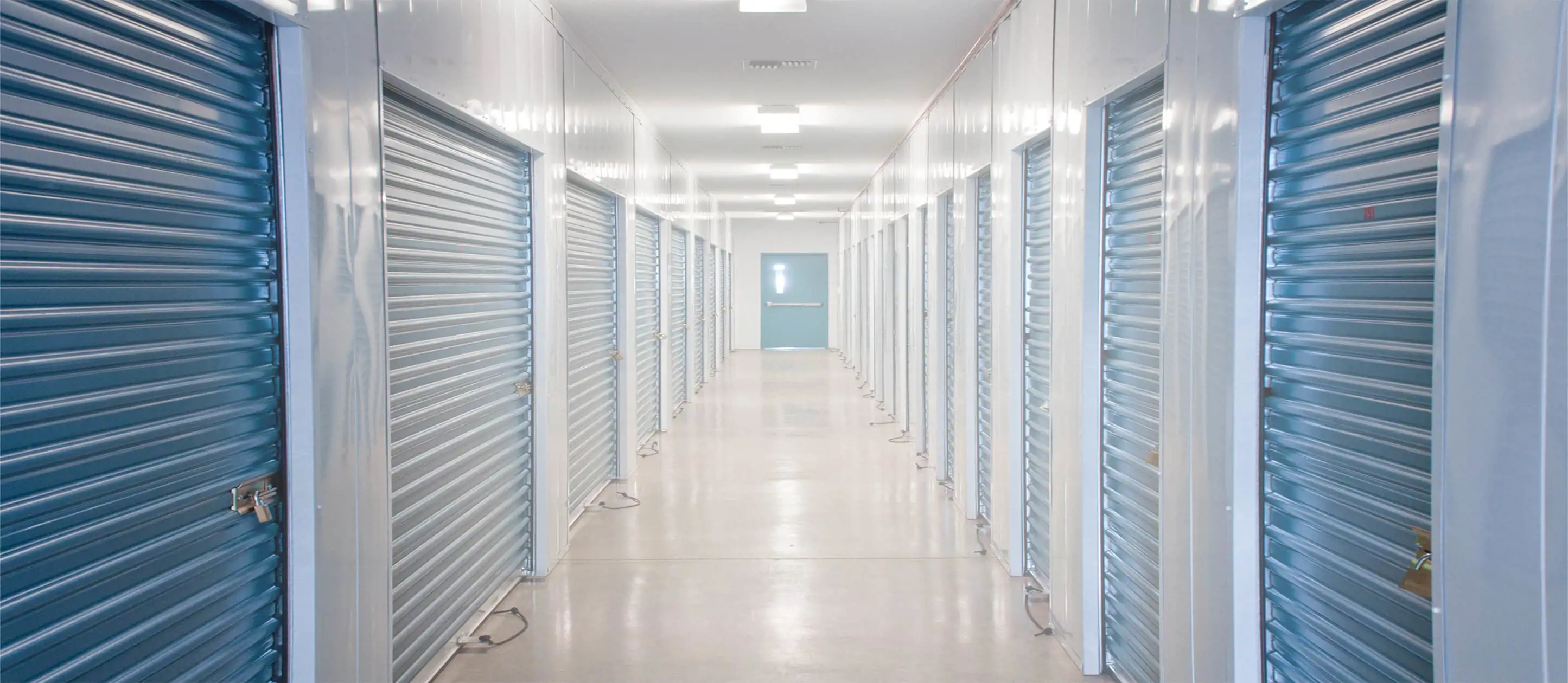 Image of a long corridor of indoor storage units