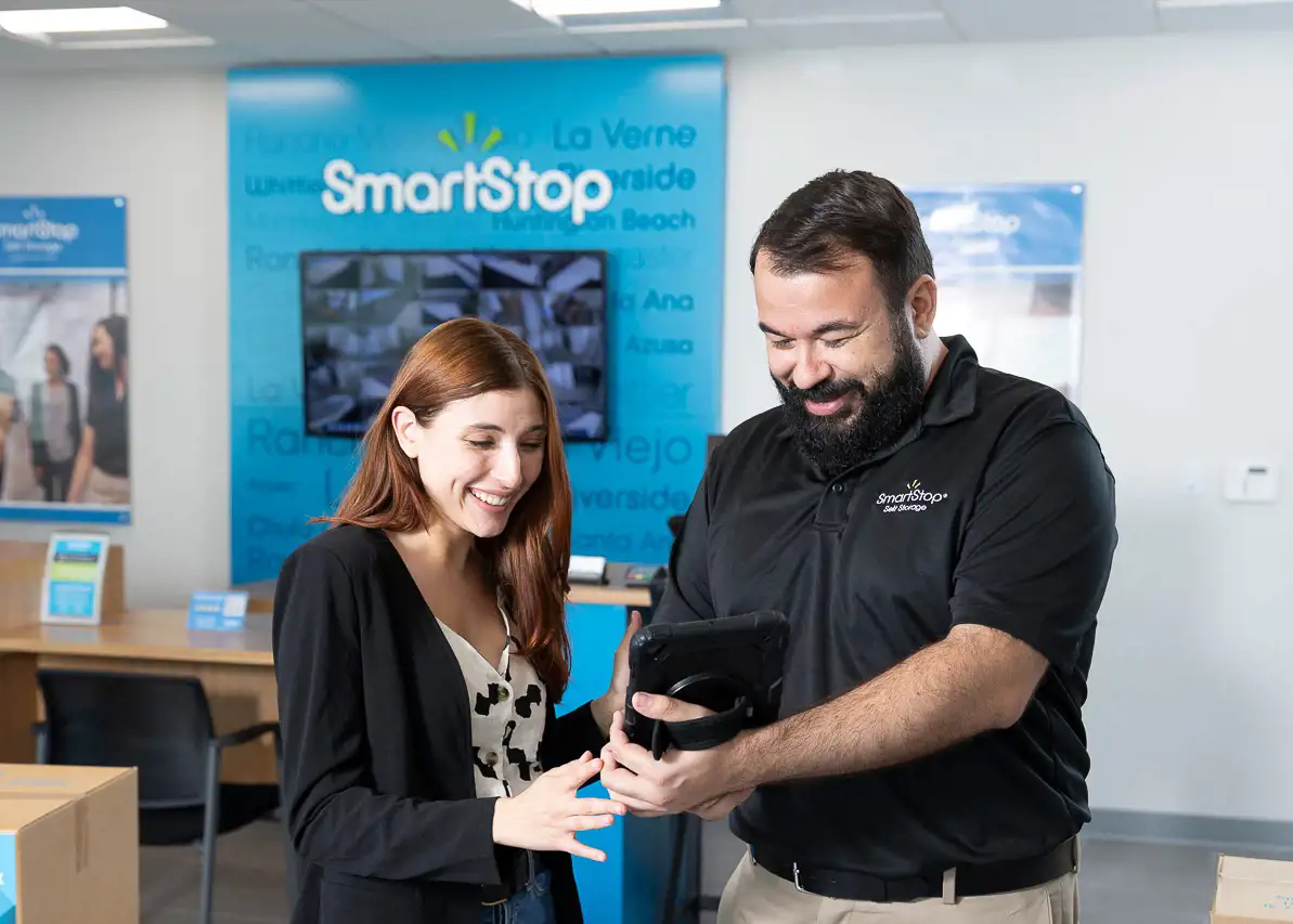 SmartStop employee providing great customer service to potential renter in office